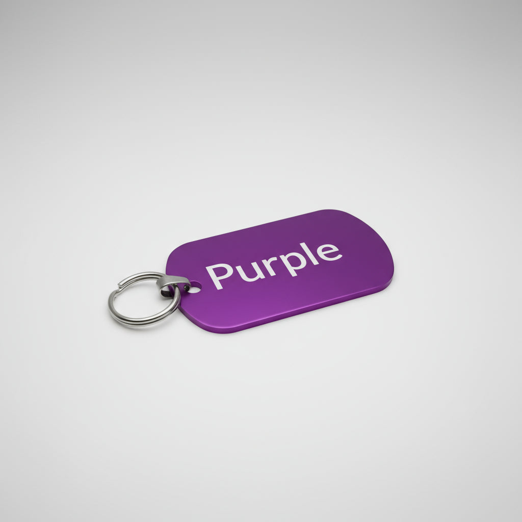 Purple key tag with 'Purple' text on a light wooden surface
