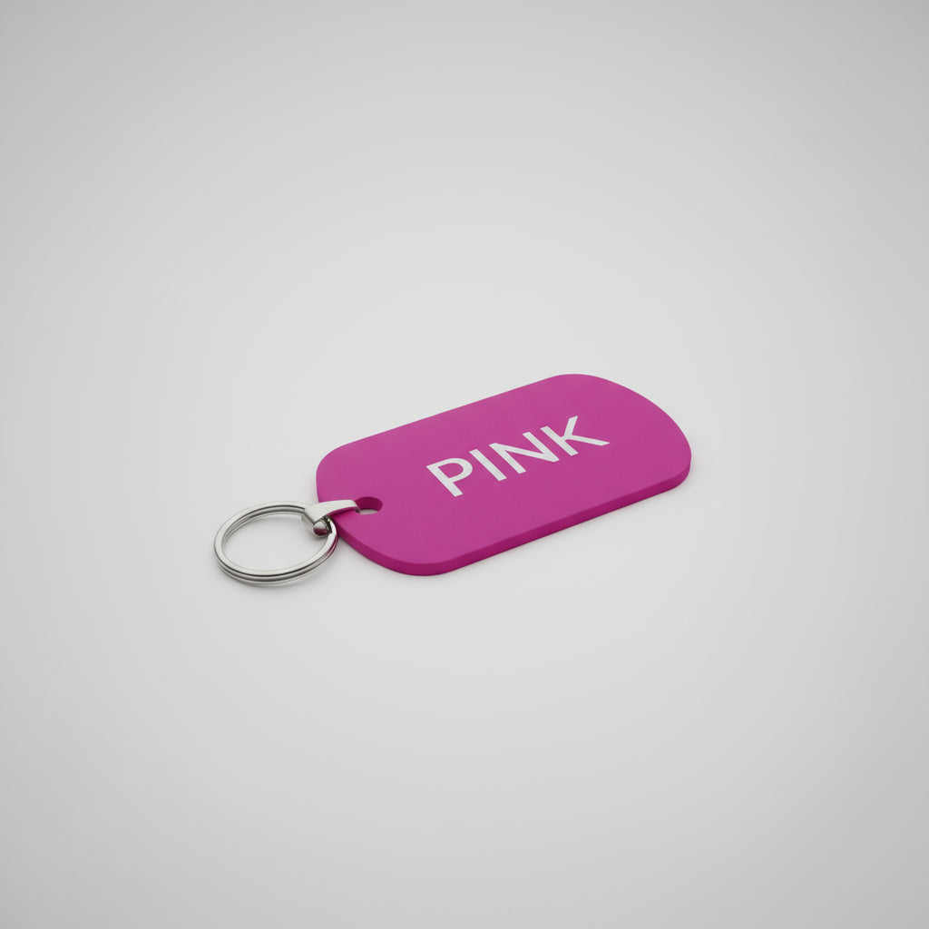 Pink tag with 'PINK' text on a gray surface