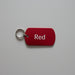 Red key tag with 'Red' text on a gray surface