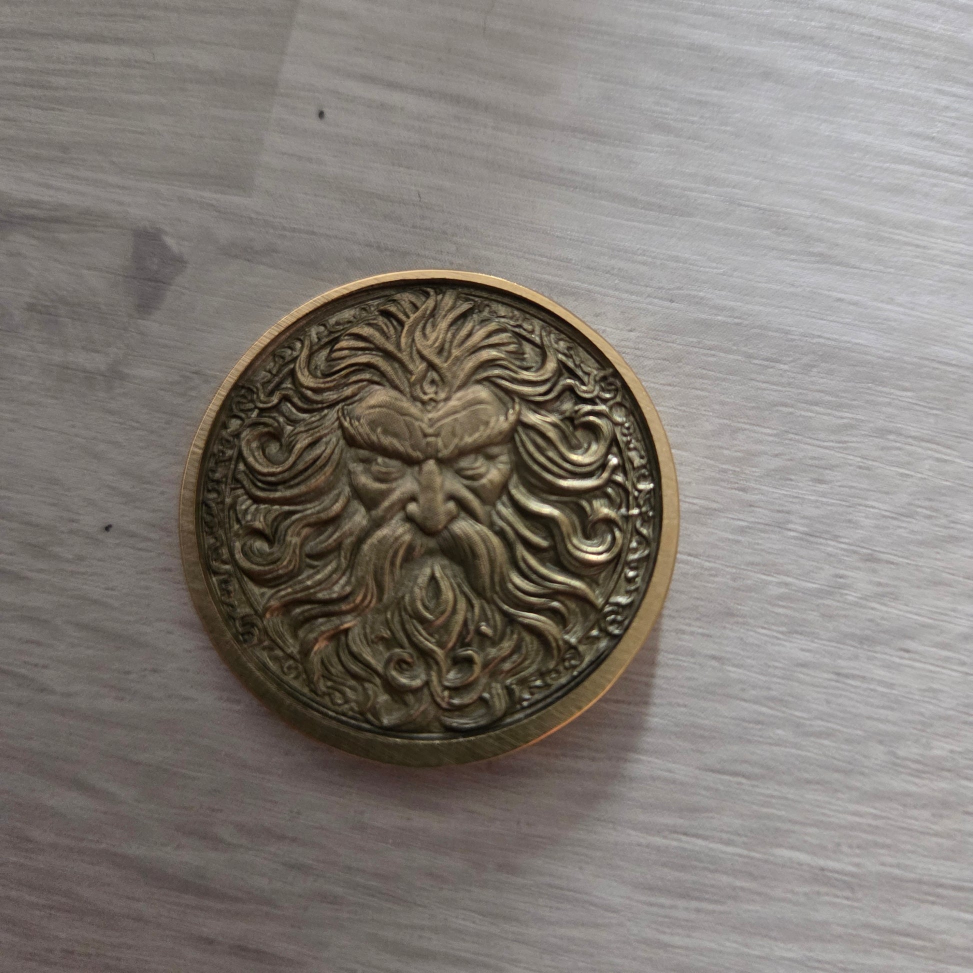 Bronze coin with intricate design 
