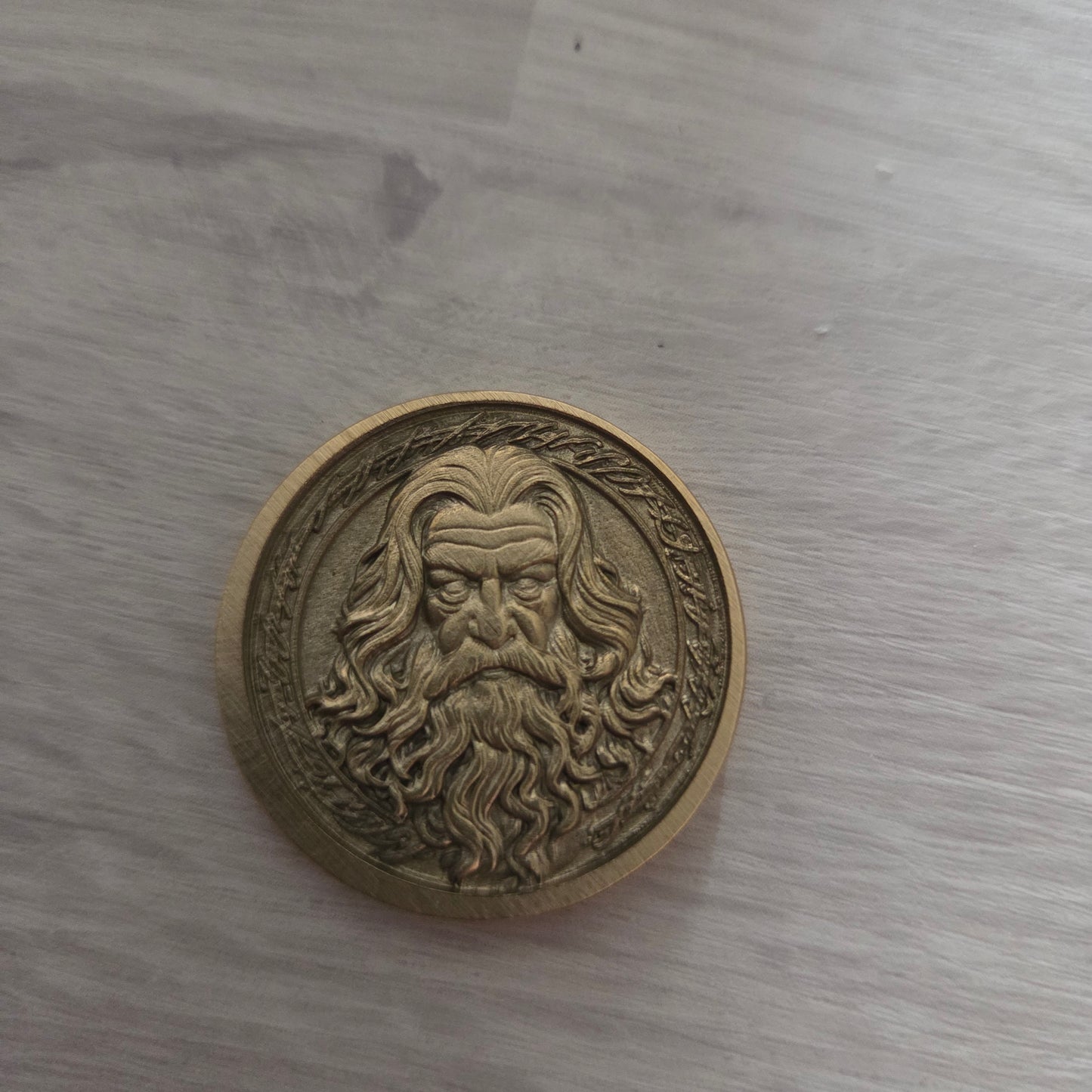Bronze coin with intricate design 
