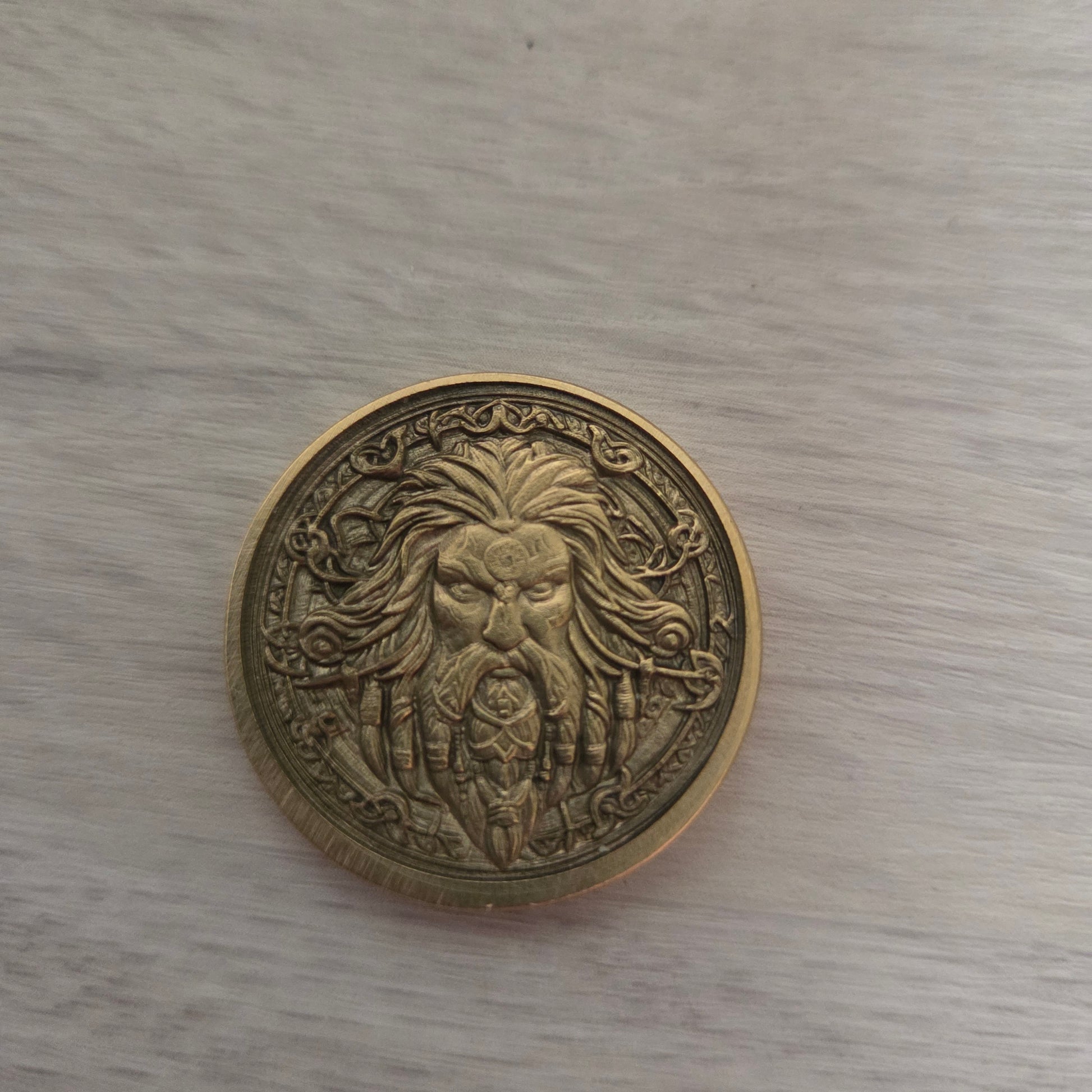 Bronze coin with intricate design 