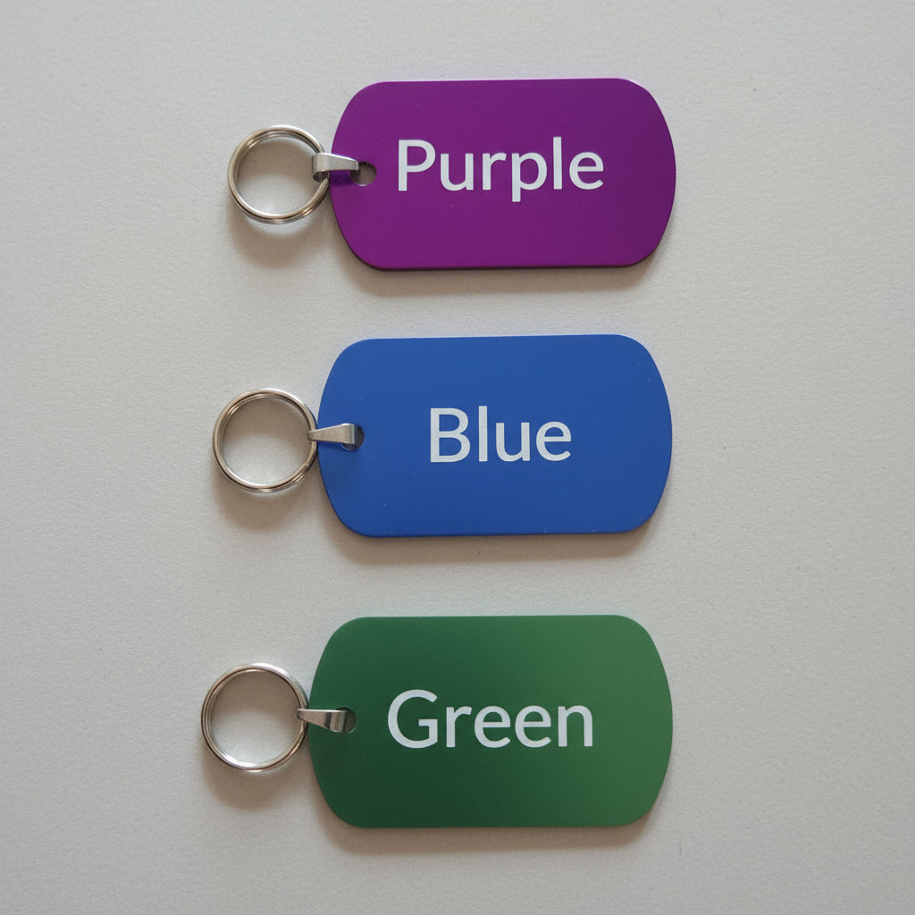 Three color tags labeled Purple, Blue, and Green on a wooden surface.