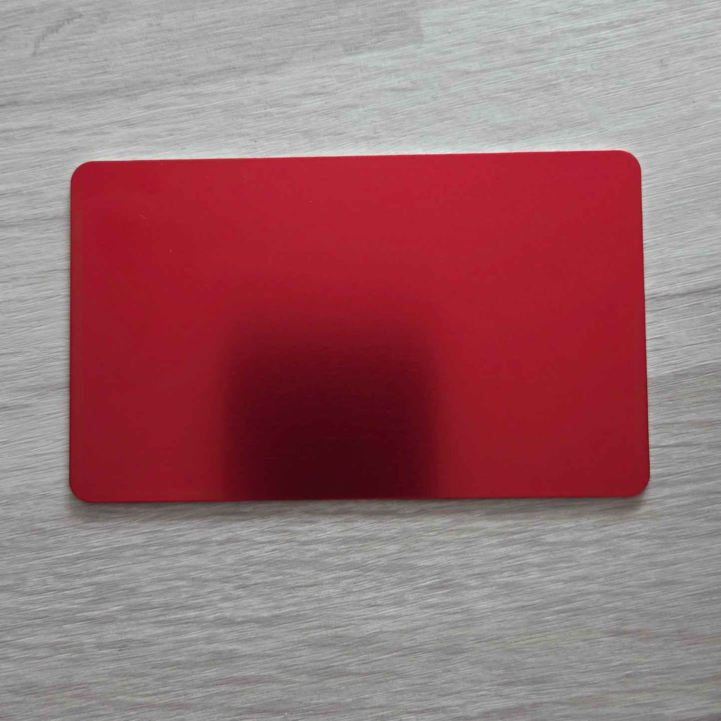 Red card on a wooden surface