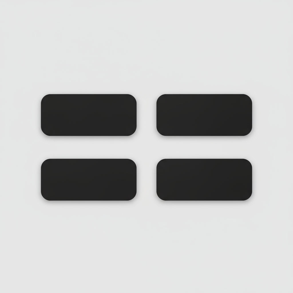 Four black rectangular phone cases on a light wooden surface