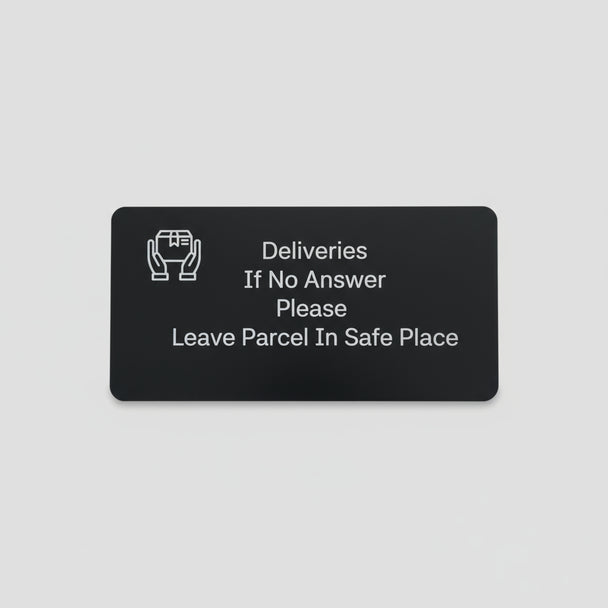 Black card with white text on a wooden surface