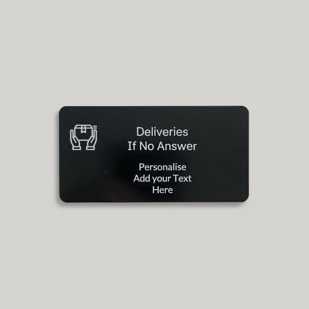 Black card with text and a logo on a wooden surface