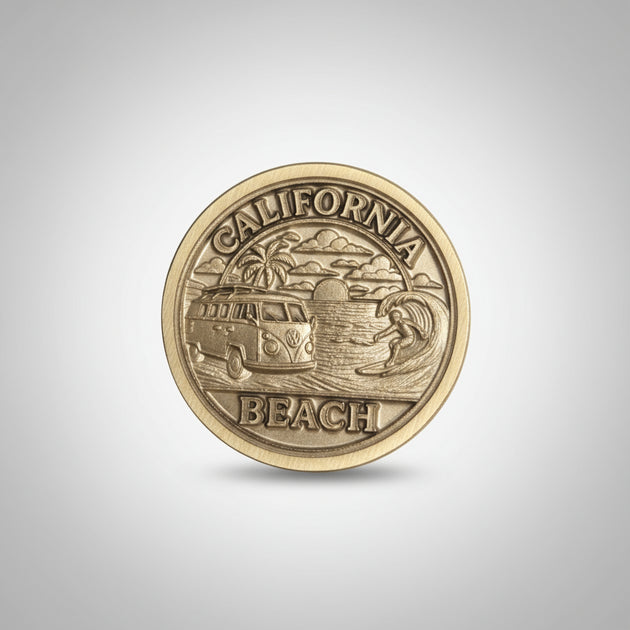 Gold coin with 'California Beach' text held in a hand against a gray background