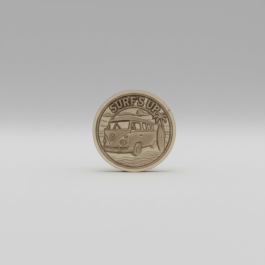 Metallic coin with embossed design on a textured gray surface