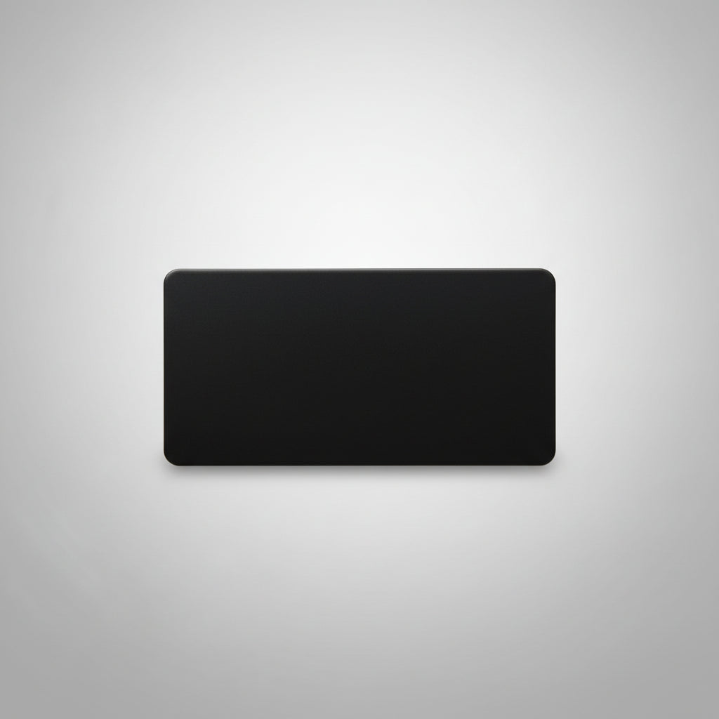 Black rectangular object on a textured gray surface