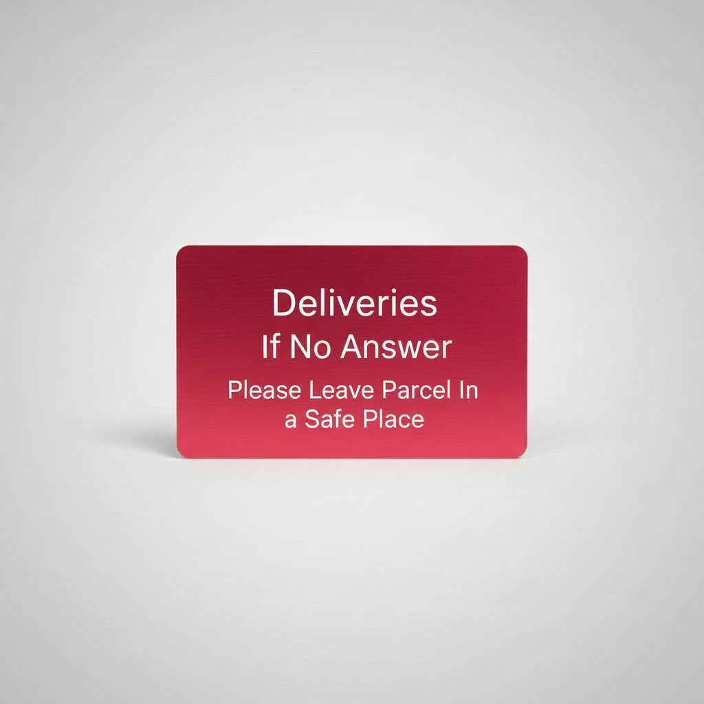 Red card held by a hand on a gray textured surface